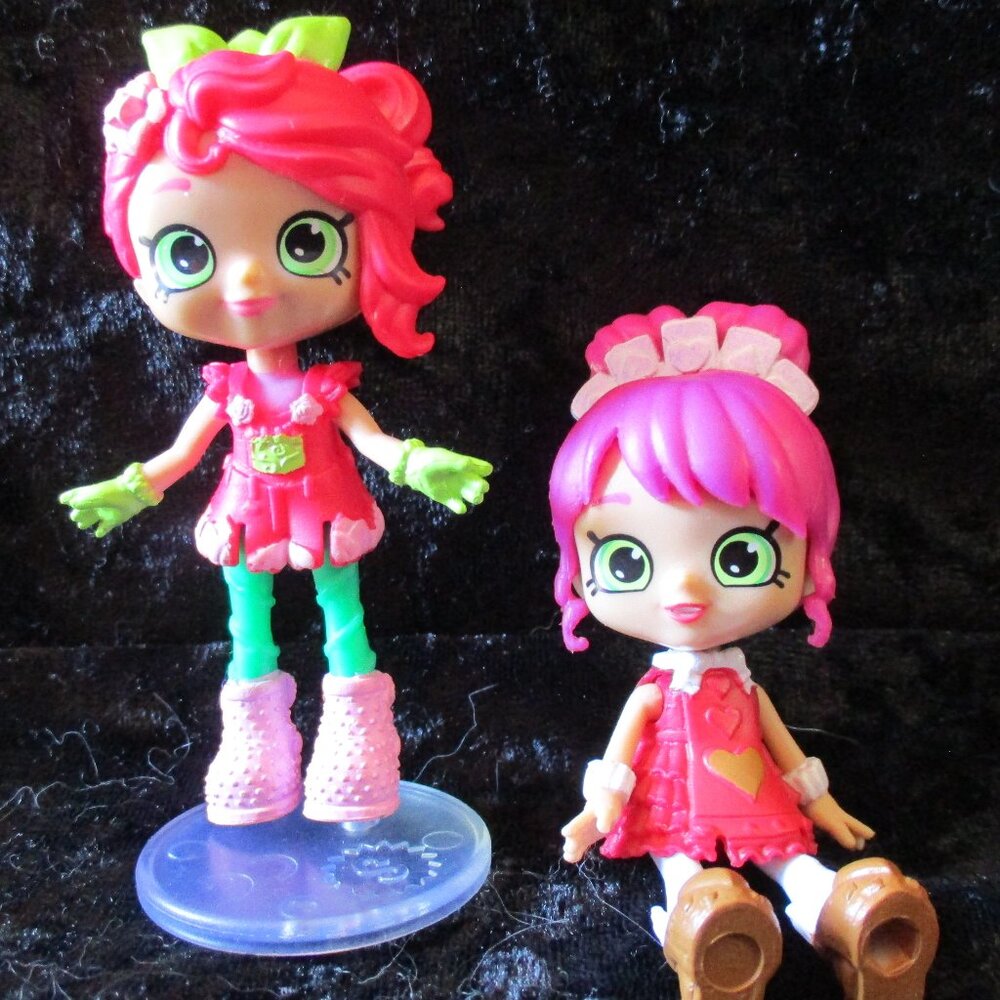 Two (2) Shopkins Dolls w/Removable Dresses & One (1) Doll Stand